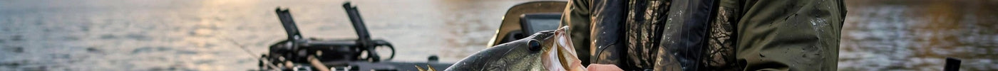 Angler holding a largemouth bass in a boat at golden hour on an autumn Ontario lake
